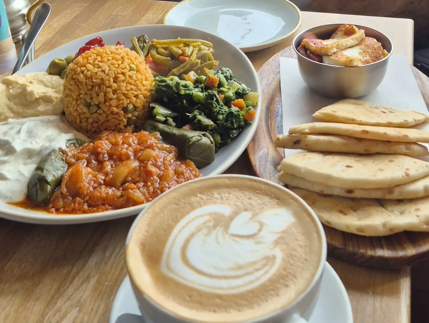 Mezze platter with flatbreads, halloumi and a flat white at The Richmond Cafe
